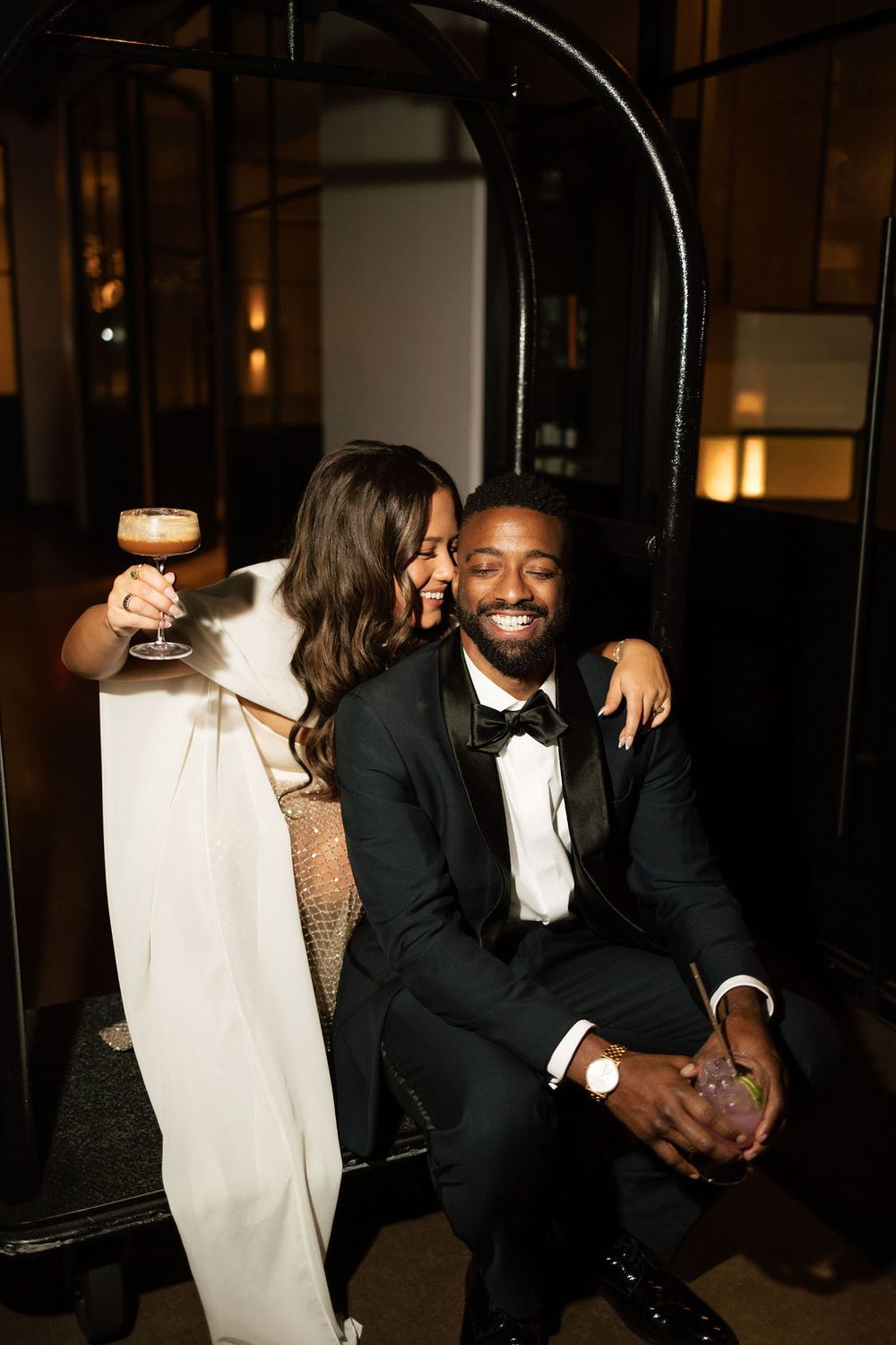 Bride and groom sharing an espresso martini